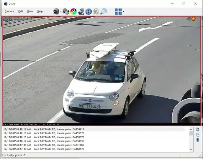 License plate recognition software reading a car's plate at a roadside camera and logging it